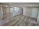 Spacious living room with hardwood floors, seamlessly connecting to the modern kitchen at 1642 Palma Vista Ave, Las Vegas, NV 89169