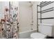 Clean bathroom featuring a shower-tub combo, neutral tile, and shower curtain at 1701 E Katie Ave # 57, Las Vegas, NV 89119