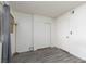Cozy bedroom with wood-look floors, closet with sliding doors, and a full view of the door at 1701 E Katie Ave # 57, Las Vegas, NV 89119