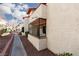 Apartment building exterior with landscaped walkway and secure window bars for added safety at 1701 E Katie Ave # 57, Las Vegas, NV 89119