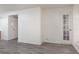 Spacious living room showcasing the wood-look floors, neutral walls, and decorative glass panel door at 1701 E Katie Ave # 57, Las Vegas, NV 89119