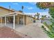 Expansive backyard featuring a covered patio and space for outdoor activities, alongside a long driveway at 1904 Chapman Dr, Las Vegas, NV 89104