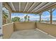 Charming balcony with decorative string lights and a scenic cityscape view with palm trees under a blue sky at 1904 Chapman Dr, Las Vegas, NV 89104