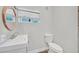 Bathroom featuring a white vanity, modern fixtures, and a toilet at 1904 Chapman Dr, Las Vegas, NV 89104