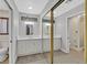 Bathroom featuring double sinks, white cabinets, and a mirrored closet for ample storage at 1904 Chapman Dr, Las Vegas, NV 89104