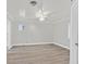 Empty bedroom with laminate flooring, neutral paint, ceiling fan, and a window at 1904 Chapman Dr, Las Vegas, NV 89104