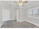 Neutral-toned bedroom with hardwood floors and a window view at 1904 Chapman Dr, Las Vegas, NV 89104