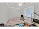 Bedroom with a ceiling fan and a window at 1904 Chapman Dr, Las Vegas, NV 89104
