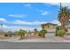 Two-story home with a two car garage and desert landscaping in front yard at 1904 Chapman Dr, Las Vegas, NV 89104