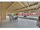 Covered patio with seating next to the pool; perfect for entertaining guests outdoors in a private yard at 1904 Chapman Dr, Las Vegas, NV 89104