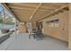 Covered patio with outdoor seating, offering a shaded area for dining and relaxation, next to the pool at 1904 Chapman Dr, Las Vegas, NV 89104