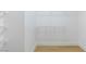 Walk-in closet features wood floors and wire shelving for optimal storage at 2160 Point Mallard Dr, Henderson, NV 89012