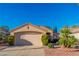 Charming single-story home with manicured landscaping, desert foliage, and a two-car garage at 2160 Point Mallard Dr, Henderson, NV 89012