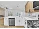 Beautiful kitchen with stainless steel appliances, white countertops and light wood cabinets at 2160 Point Mallard Dr, Henderson, NV 89012