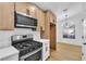 Bright kitchen features modern stainless steel appliances, sleek cabinetry, and white countertops at 2160 Point Mallard Dr, Henderson, NV 89012