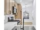 Modern kitchen features stainless steel appliances, sleek cabinetry, and white countertops at 2160 Point Mallard Dr, Henderson, NV 89012