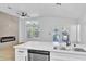 Modern kitchen featuring stainless steel appliances, white countertops, and a view of the backyard at 2160 Point Mallard Dr, Henderson, NV 89012