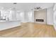 Bright, open living room with modern fireplace and laminate flooring throughout at 2160 Point Mallard Dr, Henderson, NV 89012