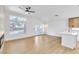 Open living space with wood floors, modern fireplace and seamless access to the kitchen and backyard at 2160 Point Mallard Dr, Henderson, NV 89012