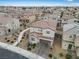 Home exterior with tiled roof, paved driveway, a patio, and nice landscaping at 2205 Stone Well Rd, North Las Vegas, NV 89031