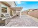 Enjoy outdoor entertaining with this covered patio, grill, and low-maintenance landscape at 2205 Stone Well Rd, North Las Vegas, NV 89031
