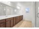 Bathroom boasts dual sinks, sleek vanity, and a shower for a functional design at 2205 Stone Well Rd, North Las Vegas, NV 89031