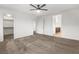 Large bedroom with a ceiling fan, neutral walls, carpet, and a walk-in closet at 2205 Stone Well Rd, North Las Vegas, NV 89031