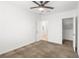 The carpeted bedroom includes a ceiling fan, and adjacent closet and bathroom at 2205 Stone Well Rd, North Las Vegas, NV 89031