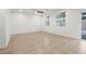 The spacious living room features tile floors, multiple windows, and abundant natural light at 2205 Stone Well Rd, North Las Vegas, NV 89031