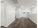 Open loft space filled with natural light from windows, carpet floors, and neutral walls at 2205 Stone Well Rd, North Las Vegas, NV 89031