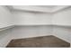 Spacious walk-in closet with carpet and shelving for optimal storage and organization at 2205 Stone Well Rd, North Las Vegas, NV 89031