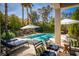 Lush backyard with sparkling pool and inviting lounge area perfect for outdoor relaxation and entertainment at 2287 Moresca Ave, Henderson, NV 89052