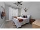 Bright bedroom with white and orange patterned bedding and guitar decor at 2287 Moresca Ave, Henderson, NV 89052