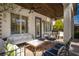 Cozy covered patio with comfortable seating, ceiling fan, and wood ceiling, creating a perfect outdoor living space at 2287 Moresca Ave, Henderson, NV 89052