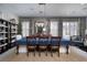 Elegant dining room with a large table, chairs and decorative shelving at 2287 Moresca Ave, Henderson, NV 89052