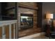 Close-up of a modern fireplace with decorative wood surround and adjacent built-in cabinetry at 2287 Moresca Ave, Henderson, NV 89052