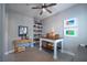 Inviting home office with a custom desk and shelving, perfect for study or creative work with warm lighting at 2287 Moresca Ave, Henderson, NV 89052