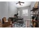 Well-lit home office with a modern desk, ample seating, and decorative shelving at 2287 Moresca Ave, Henderson, NV 89052