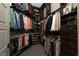 Organized walk-in closet with ample hanging space, shelves, and shoe storage at 2287 Moresca Ave, Henderson, NV 89052