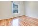 Well lit bedroom with hardwood floors and a large window for natural light at 2305 W Horizon Ridge Pkwy # 514, Henderson, NV 89052