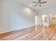 Bright bedroom with hardwood floors, a ceiling fan, and ensuite bathroom and closet access at 2305 W Horizon Ridge Pkwy # 514, Henderson, NV 89052