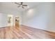 Bedroom featuring hardwood floors, a ceiling fan, and access to the ensuite bathroom and walk-in closet at 2305 W Horizon Ridge Pkwy # 514, Henderson, NV 89052