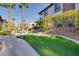 Community space with lawn, picnic tables, BBQ, and lush landscaping at 2305 W Horizon Ridge Pkwy # 514, Henderson, NV 89052