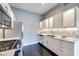 A modern kitchen boasts stainless steel appliances, sleek white cabinetry, and stylish backsplash at 2305 W Horizon Ridge Pkwy # 514, Henderson, NV 89052