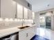 Contemporary kitchen with stainless steel appliances, ample cabinet space, and a sliding door to the patio at 2305 W Horizon Ridge Pkwy # 514, Henderson, NV 89052