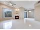 Living room features tile flooring, fireplace, ceiling fan and natural lighting at 2305 W Horizon Ridge Pkwy # 514, Henderson, NV 89052