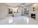 A living area features a fireplace, ceiling fan and shiny tile floors at 2305 W Horizon Ridge Pkwy # 514, Henderson, NV 89052