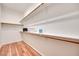 Walk-in closet with custom shelving and hardwood floors for optimal storage at 2305 W Horizon Ridge Pkwy # 514, Henderson, NV 89052