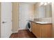 Bathroom featuring tiled floors, and a sink with vanity and cabinets at 2405 W Serene Ave # 631, Las Vegas, NV 89123