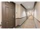 Long hallway with carpet and architectural details, leading to unit 631 at 2405 W Serene Ave # 631, Las Vegas, NV 89123